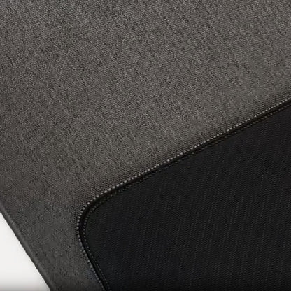 Close-up texture of dark grey woven desk mat