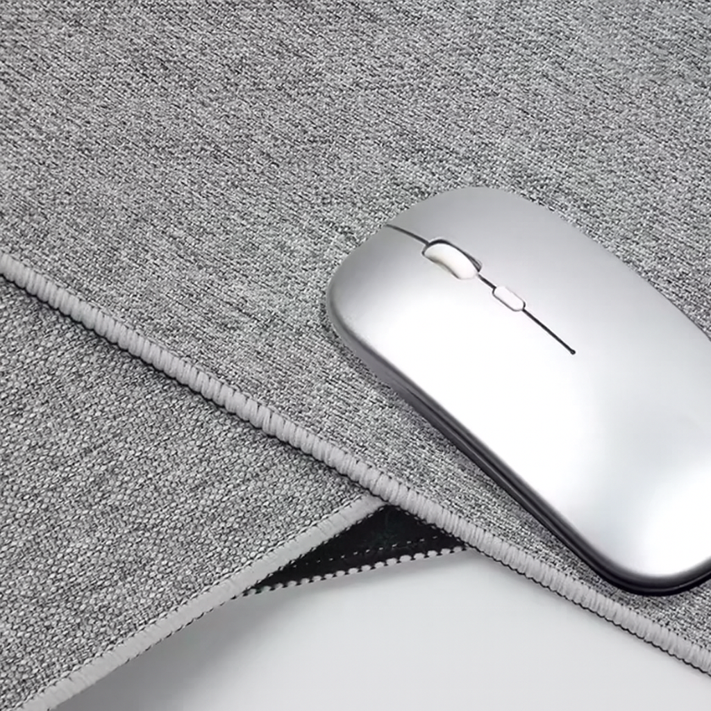 Close-up texture of light grey woven desk mat